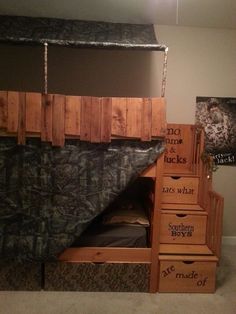 a loft bed with stairs and storage drawers