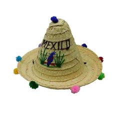 Tiny palm leaf zapata bolita hat for children. Colorful pom pom accent around brim. Embroidered MEXICO, and bird accent. All around curled brim, 2" wide. Chin cord. One size, 48 cm, fits 6-12 mos. oth Wide Brim Beach Hat For Cinco De Mayo, Wide Brim Hats For Beach And Cinco De Mayo, Brimmed Beach Hats For Cinco De Mayo, Adjustable Straw Hat For Beach And Cinco De Mayo, Traditional Hat For Beach And Cinco De Mayo, Adjustable Hats For Cinco De Mayo Vacation, Novelty Brimmed Beach Hat, Beach Novelty Mini Hat With Curved Brim, Mexican Hats