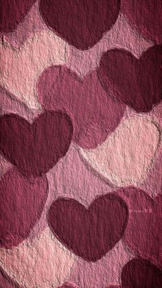 some red hearts are arranged in the shape of heart shapes on a pink and purple background