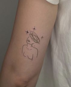 a woman's arm with a small tattoo on the left side of her body