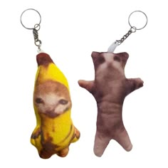 two keychains with pictures of animals on them, one has a banana and the other has a monkey