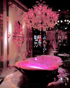 a fancy chandelier hanging from the ceiling in a room