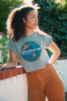 Let's clean up... before the visitors arrive. 100% Organic Cotton, harvest and made in Tanzania with fair and ethical wages. Machine Wash Cold *Do not Iron the Art We're proud to bring you high-quality, eco-friendly clothing made to last. Holding Court Inc creates top-quality apparel using certified organic materials made in line with slow fashion methods. We're committed to eliminating waste by making all of our products to order, and planting trees for every order purchased, keeping our environmental impact to a minimum. As a small, female-owned business, every purchase you make at Holding Court Inc by Courtney Barriger supports an independent, sustainable brand and artists. So you can feel good knowing where your hard-earned dollars are going. Sizes S M L XL Chest 81-86 cm 32-34' 88-94 Organic Cotton Crew Neck T-shirt, Eco-friendly Cotton Tops For Everyday, Conscious Style Cotton T-shirt For Everyday, Organic Cotton Crew Neck Tops, Conscious Style Everyday Cotton T-shirt, Everyday Conscious Style Cotton T-shirt, Eco-friendly Organic Cotton Tops With Screen Print, Sustainable Cotton Short Sleeve T-shirt, Conscious Style Cotton T-shirt With Relaxed Fit