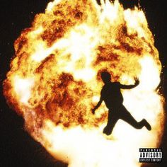 a person jumping in front of a large fireball