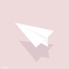 a white paper airplane on a pink background