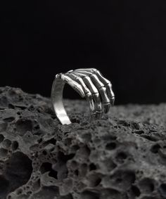 Material: S925 Sterling Silver Height: 14.0 mm Thick: 1.0 mm Weight: 5.8 g Please note: Each ring is made by hand so may differ slightly but the quality and workmanship are always the best. Your ring will come in a beautiful case, ideal for gifts or just storing your jewelry safely. It will be posted in an extremely secure package to make sure its safe arrival at your door. Thanks for stopping in my store. If you have any questions please fell free to contact me. best regards, Punk Sterling Silver Skull Ring Gift, Punk Style Sterling Silver Skull Ring Gift, Punk Skull Ring In Sterling Silver, Silver Grunge Ring Jewelry, Silver Grunge Rings For Halloween, Silver Grunge Rings For Gifts, Grunge Style Rings For Halloween Gift, Handmade Sterling Silver Skull Ring For Halloween, Handmade Gothic Sterling Silver Skull Ring