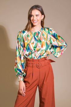 A printed woven top featuring round neckline, blouson sleeve with smocked cuff and back neck button closure Details: Self : 100% Polyester Size & Fit - Model is 5`8" And Wearing Size Small- Measurements Taken From Size Small- Approx. Length: 23" Fall Multicolor Lantern Sleeve Blouse, Multicolor Printed Lantern Sleeve Blouse, Multicolor Lantern Sleeve Printed Blouse, Multicolor Printed Blouse With Lantern Sleeves, Multicolor Puff Sleeve Blouse For Fall, Chic Multicolor Lantern Sleeve Blouse, Chic Printed Blouse With Balloon Sleeves, Fall Printed Tops With Balloon Sleeves, Fall Tops With Printed Balloon Sleeves