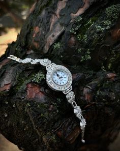 Womens Circle Iced Wrist Watch 925 Sterling Silver, Handmade Shiny Zircon Gems Watch For Woman, 925K Female Watch, Unique Gift For Her ▶ Only 1 Available For This Style. This 925 Sterling Silver Iced Out Watch For Women is Rhodium plated on 925 Sterling Silver. That's why it never tarnishes. Product; Except for the round case back of the watch (Stainless Steel), it is made of 925 sterling silver and is crafted with hundreds of zircon stones.◀ ✦Item Details Everything about the watch except its m Silver Cubic Zirconia Watch As Gift, Silver Cubic Zirconia Jewelry And Watches As Gift, Cubic Zirconia Jewelry With Round Dial For Gifts, Classic Silver Diamond Watch With Cubic Zirconia, Luxury Silver Diamond Watch For Wedding, Luxury Silver Jewelry And Watches With 17 Jewels, Silver Diamond Watch With 17 Jewels, Silver Diamond Watch With Bracelet Strap As Gift, Silver Round Diamond Watch With 17 Jewels