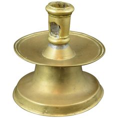 two tiered brass candle holder on white background