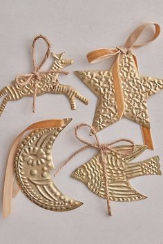 gold metal ornaments with bows and ribbons