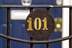 an iron gate with the number 101 on it