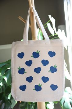 Blueberry tote bag made of 12oz. 100% Certified Organic Chemical Free Canvas Fabric. Design on bag is made from high quality, direct to transfer print. CARE INSTRUCTIONS:  - Handwash bag inside out in cold water.   - Air dry flat.   - Do not iron directly on the design. Tote Bag Ideas, Eraser Stamp, Bags Ideas, Blue Tote Bag, Free Canvas