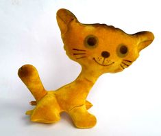 a yellow cat toy sitting on top of a white table