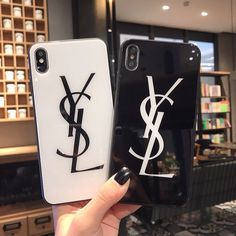 two phone cases with the same logo on them, one has a black and white background