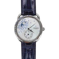 Guaranteed authentic Hermes Arceau Petite Lune Watch featured in the 38 mm large model.This beautiful diamond and sapphire set watch has gems sprinkled on the bezel and on the mother of pearl dial. The moon phase indicator has a blue background and rhodium plated decoration.Steel case is et with 22 (0.25ct) blue sapphires and 10 (0.008 ct) diamonds.Mother of Pearl dial is set with a gem count of 65 (1.188ct) blue sapphires and 58 (0.058ct) diamonds.Interchangeable strap is Blue Sapphire alligato Luxury Blue Watches For Evening, Luxury Blue Evening Watch, Blue Diamond Watch With Diamond Hour Markers, Luxury Watch With Diamond Hour Markers, Luxury Watches With Diamond Hour Markers, Luxury Round Watch With Diamond Hour Markers, Hermes Watch, Hermes Box, Watch Sale