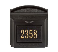 a black mailbox with gold numbers and the number 2238 on it's front