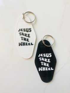 two keychains with the words jesus take the wheel and jesus take the wheel written on them