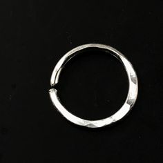 18 gauge Septum Ring / Nose Ring / Cartilage Ring - made from sterling silver - all ends are rounded / de-burred / polished - 10mm across or choose an alternate size - nickel free - measurement are INNER diameter - you open these to the side so as to retain the circle shape - this ring has a flattened lower edge that has been hammered - these are sold as singles My catchless endless rings are handmade by me with hard temper wire to ensure they retain their shape. Polished and rounded earring end Nickel-free White Gold Septum Ring, Nickel Free Silver Cartilage Earrings, Nickel Free Silver Round Cartilage Earrings, Nickel-free Silver Round Cartilage Earrings, Silver Internally Threaded Toe Ring, Nickel-free Silver Hoop Rings, Nickel-free Sterling Silver Midi Rings For Jewelry Making, Sterling Silver Open Ring Cartilage Earrings As Gift, Silver Round Cartilage Earrings Gift