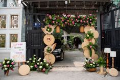 an entrance to a building decorated with flowers