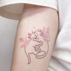 a small tattoo on the arm of a woman