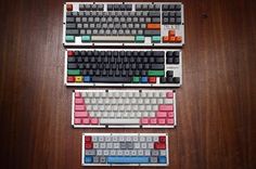 three keyboards are stacked on top of each other with different colored keys and numbers attached to them