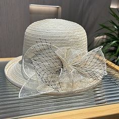 Category:Fascinators,Hats,Headwear; Embellishment:Flower,Bows,Pure Color,Splicing,Tulle; Gender:Women's; Quantity:1 PC; Theme:Vintage Theme,Head,Fashion,Birthday,Holiday,Classic Theme,Beach Theme,Wedding; Style:Vintage,Elegant; Hats Category:Sun Hat,Straw Hat,Bucket Hat,Bowler / Cloche Hat; Occasion:Holiday,Casual; Material:Tulle,Polyester; Front page:WE; Shipping Weight:0.13; Listing Date:03/18/2024; Head Circumference: Cream Cloche Hat For Summer Church Events, Summer Cream Cloche Hat For Church, Adjustable Cloche Mini Hats For Summer, Summer Adjustable Cloche Mini Hats, Adjustable Cloche Straw Hat For Church, Elegant Mini Hats For The Beach, Elegant Adjustable Bucket Hat With Flat Brim, Adjustable Cloche Hat For Church, Spring Adjustable Cloche Hat For Church