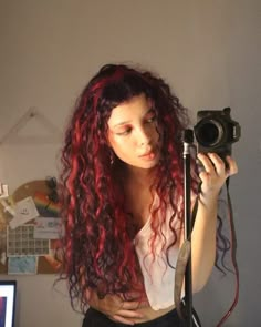 Scarlet Strands: The Best Red Highlight Looks Chunky Red Highlights Curly Hair, Curly Hair Dyed Underneath Red, Curly Red Highlighted Hair, Hot Pink Highlights In Brown Hair Curly, Curly Hair With Streaks Of Color, Ruby Red Curly Hair, Brown And Red Curly Hair, Brown Hair With Red Highlights Curly, Black Red Hair Curly