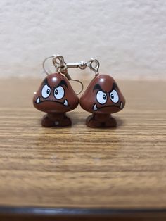 Get your Goomba's! These little critters are everywhere. Fun, unique, quirky and down right beautiful these statement earrings are a definite talking point!  Made using a minifigure a silver wire hoop and a rubber stopper. Simple and effective but guaranteed to get noticed! Mario Clothes, Mario Earrings, Sound Machine, Retro Earring, Little Critter, Stainless Steel Wire, Super Mario, Silver Wire, Mini Figures