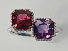 New design in our Decouture collection - Duo of cushion cut Rhodolite Garnet and Amethyst set with diamonds and white gold. Looks like a stack of two rings on your finger (without the mess of constant rotating and scratching!).  SS Diamonds G/SI BR 0.090ct/38pc  CS Rhodolite Garnet CUS 1.940ct/1pc   CS Amethyst CUS 1.500ct/1pc  Modern, yet classic, design, natural high-quality gemstones at very reasonable price. Other gemstones would be added in separate listings. Please contact us for a specific pair of gems - like yours and your partner's  birthstones (a very romantic gift for your anniversary). Please order any size and state the desired one, ideally together with your finger circumcision in mm, in the comment. Free shipment by Fedex Luxury Cushion Cut Gemstones With Prong Setting, Luxury Amethyst Cushion Cut Ring For Formal Occasions, Luxury Amethyst Cushion Cut Ring For Formal Events, Luxury Cushion Cut Amethyst Ring For Formal Occasions, Luxury Cushion Cut Gemstones For Wedding, Luxury Cushion Cut Amethyst Ring For Anniversary, Formal Cushion Cut Gemstones With Accent Stones, Cushion Cut Gemstones With Accent Stones For Formal Occasions, Amethyst Set