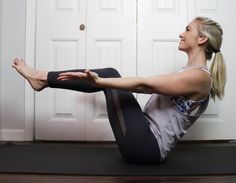 a woman sitting on the floor with her legs crossed