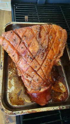 a large piece of meat sitting on top of a pan