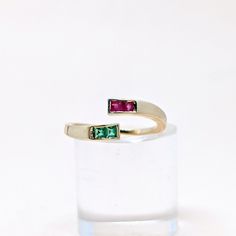 Natural Fine Ruby Emerald Baguette Stone Open Cuff Ring. Precious Gemstone Ring in 14k SOLID GOLD For Her from our Capsule Jewelry Collection. Ruby Emerald Gemstones are set in  Chenal Setting in our Factory. Gold Ring AA+ Quality. Perfect Gift For Everyday or December Birthstone Ring Gift for Your Loved Ones. ►  DIMENSIONS : ◆ Gemstone : Ruby, Emerald 0 30 Cts               ◆ Stone size : 2*2 mm (4Pcs )                                ◆ Shank Width : 1 mm      ◆  Material :  14k Yellow Gold Multi-stone Emerald Open Ring For Anniversary, Open Ring Emerald With Multi-stone For Anniversary, Emerald Open Ring With Multi-stones For Anniversary, 14k Gold Multi-stone Emerald Cut Rings, 14k Gold Fusion Ring For Anniversary, Multi-stone Baguette Cut Promise Ring, Baguette Cut Multi-stone Promise Rings, Fine Jewelry Stackable Multi-stone Open Rings, Fine Jewelry Stackable Open Rings With Multi-stone