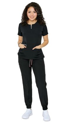 Be ready to impress the second you put on Dress A Med's Soft Stretch Silver Zipper jogger set. This 2 piece uniform scrubs set is ultra-flattering with its accent silver zipper neckline. You'll be sure to show off your figure while still maintaining your trusted and professional image. This uniform soft stretch scrubs set is made to be dazzling as you are with its accentuating double stitch lines. The scrub top is modern yet ultra-useful with a zipper compartment and 2 large pockets. The jogger Nurses Uniform Modern, Nursing Scrubs Pattern, Medical Scrubs Fashion, Scrubs Pattern, Cute Scrubs, Surgical Tech, Scrubs Uniform, Natural Hairstyle, Women's Uniforms