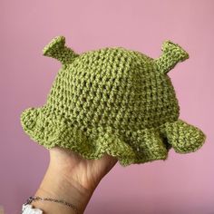 By VERY popular demand, I introduce to you the cutest little Shrek hat you've EVER SEEN! Handmade crochet Shrek hat for babies aged from 0-6 months ish, or a little older as there's plenty of stretch in the material. Made using super soft acrylic yarn which is gentle on your baby's skin, and can be washed on a low heat with your usual washing. Can be made in any 3 of the Shrek-ky green shades, perfect gift for Shrek loving parents! Adjustable Green Hat For Playtime, Cute Crochet Hat With Curved Brim, Cute One Size Hat, Adjustable Playful Yarn Beanie, Cute Green Hats For Playtime, Cute Green Hat For Playtime, Fun Green Hat For Playtime, Cute Green Hat With Curved Brim, Cute One Size Fits Most Brimmed Crochet Hat