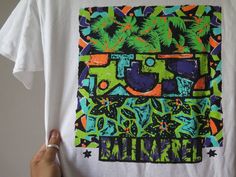 "Vintage Bali Barrel T Shirt Vintage Surf Wear 90s Beach Wear 90s Tropical Graphic Single Stitch Surfing t Shirt Surf fashion o Size armpit to armpit 19.5\" top to botton 28\" shoulder width 19\" (inch) o Fabric cotton 100% made in U.S.A. o Condition great vintage condition 8.5/10 oo If you are in any interested and have any questions? Please do ask me on various details, I am more than happy to help oo \" Shipping Wordwide\" registered airmail thailand post (small package) receiving the item Wi Green Hawaiian Graphic Print Tops, Green Cotton Hawaiian T-shirt, Green Hawaiian Cotton T-shirt, Tropical Multicolor Graphic Print T-shirt, Tropical Multicolor Graphic T-shirt, Multicolor Hawaiian Graphic Print T-shirt, Vintage Surf Wear, Stitch Surfing, 90s Beach