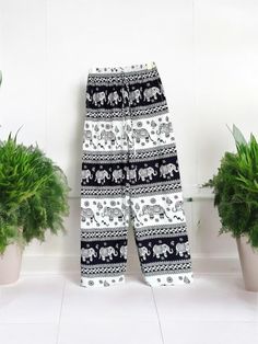 Introducing our Elephant Trousers--where comfort meets culture. Inspired by traditional Thai elephant designs, these lightweight, breathable trousers are perfect for travel or everyday wear. You can wear these trousers for casualwear, active lifestyles like Zumba/Dance Classes, travelling, festivals, loungewear and so much more! Our pants are extremely lightweight and breathable, made from 95% Italian Silk and 5% elastic.  Sizing: Waist-  24-40" Hip- 46" Inseam- 15" Length- 40" Around the legs- Cotton Lounge Pants With Character Print, Zebra Trousers, Floral Print Ankle-length Harem Pants, Elephant Shorts, Elephant Fashion, Elephant Pants, Elephant Pattern, Style Pants, Elephant Design