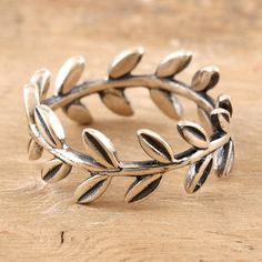 Let sinuous vines wrap your finger in delicate beauty with this lovely ring designed by India's Shivani Choudhary. Crafted from sterling silver, the band ring features a garland of leaves that circles your finger in a graceful pattern. Leaf Ring Design, Plant Ring, Silver Leaf Ring, Delicate Beauty, Sterling Silver Rings Bands, Leaf Ring, Lovely Ring, Silver Band Ring, Arm Sleeve