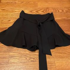 Never Worn Beautiful Black Skort By Zara With A Tie Around The Waist Chic Black Bottoms For Spring, Elegant Black Wide Leg Shorts, Black Bottoms With Elastic Waistband For Date Night, Zara Bottoms For Spring Going Out, Zara Bottoms For Going Out In Spring, Spring Zara Bottoms For Going Out, Spring Going Out Bottoms From Zara, Chic Black Wide Leg Shorts, Casual Black Skort By Zara