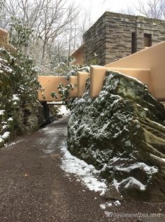 the walkway is covered in snow and rocks