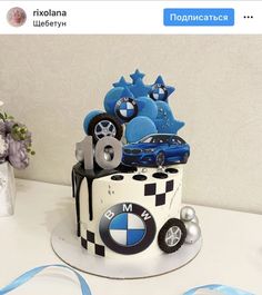 there is a cake decorated with cars and stars on the top, as well as other decorations