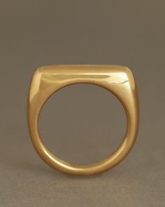 A slender gold bar ring with regal shoulders and ideal depth. Every corner and edge is softened to create a strong, geometric shape without any sharpness or discomfort. Stacks beautifully between two Dominus or Essential bands. Cast in solid 18k yellow gold~4.8mm bar width~20mm bar length Custom engraving available, up to 12 characters Handmade in our Portland studio by skilled goldsmiths, just for you. Ships approximately 2-3 weeks after receipt of your order. Engraving adds 1 extra week. Modernist 14k Gold Ring For Formal Occasions, Formal Modernist 14k Gold Ring, Modernist Open Band Rings For Formal Occasions, Classic Rectangular Signet Ring With Polished Edges, Classic Rings With Rounded Edges For Formal Occasion, Luxury Signet Ring With Smooth Bezel For Formal Occasions, Modern Square Cut Signet Ring With Polished Finish, Luxury Formal Signet Ring With Smooth Bezel, Luxury Smooth Bezel Signet Ring For Formal Events