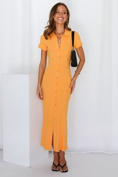 Length from shoulder to hem of size S: 120cm. Orange maxi dress. Non-lined. Cold hand wash only. Model is a standard XS and is wearing size XS. True to size. Ribbed fabric. No zipper. Slip-on style. Rayon/Spandex. You'll hypnotise everyone, without a flute, with the Tied Piper Maxi Dress. The dress has collars and buttons all the way down at the front, backless with an adorable tie. A simple piece that has a bit more personality. Style yours with black mules and a shoulder bag. Orange Maxi Dress, Black Mules, Orange Tie, Dress Orange, Ribbed Fabric, Designer Dresses, Cold Shoulder Dress, The Dress, Hand Wash