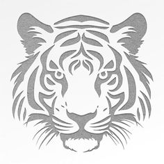 a tiger's head is shown in the shape of a stencil on a white background