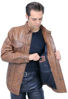 A men's brown leather shirt with a new tan antiqued finish for that well loved look. An amazingly comfortable men's shirt considered a lightweight leather jacket in premium soft lambskin leather. This lightweight brown leather shirt snaps and zips up front with features that include 2 front snap down chest pockets, 2 snap closed front belly pockets, adjustable double snap cuffs, long body style and a soft satin lining. Exclusive Jamin Leather® quality brand shirt. This men's brown leather shirt Rugged Brown Leather Jacket With Leather Lining, Brown Collared Leather Jacket With Snap Buttons, Brown Casual Leather Jacket With Snap Buttons, Casual Brown Leather Jacket With Snap Buttons, Brown Leather Button-up Outerwear, Brown Leather Button-up Jacket, Brown Leather Jacket With Snap Buttons, Rugged Brown Button-up Outerwear, Leather Travel Bag