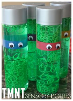 three green plastic cups with googly eyes on them and the words, tmnt sensory bottles