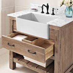 a bathroom sink with drawers underneath it