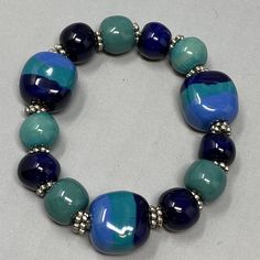 VTG Porcelain Bracelet Blue Green Teal Beads Painted Round Square Chunky 6.5" Bohemian Blue Stretch Bracelet With Large Beads, Blue Stretch Bracelet With Colorful Beads, Casual Blue Beaded Bracelet With Large Beads, Casual Blue Bracelets With Large Beads, Casual Blue Jewelry With Large Beads, Casual Large Blue Beads, Blue Stretch Bracelet With Large Round Beads, Adjustable Blue Beaded Bracelets With Large Beads, Casual Blue Stretch Bracelet With Large Beads