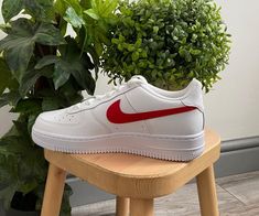 Upgrade your sneaker game with the stylish and iconic Red Heart Custom Air Force 1s. Featuring a pristine white leather upper paired with tonal red swoosh and heart detailing, these shoes are sure to draw attention to your footwear collection. With a foam sole for comfort and Nike cushioning, these shoes are as comfortable as they are stylish. iends, family, that special someone, or yourself ✨ - Exactly as shown in the pictures. - Brand New & Authentic. 💯 - Hand Painted with attention to detail. 👨‍🎨 - Waterproof and Flexible. ❤️ - Unisex model. Please refer to the Size Chart. - Free Worldwide Shipping. ✈︎ Shoe Embroidery, Air Force 1s, Custom Air Force 1, Artist Gifts, Sneaker Games, Footwear Collection, Custom Shoes, Red Heart, Air Force 1