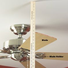 a ceiling fan with a measuring tape on it