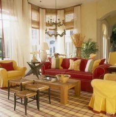 a living room with yellow and red furniture